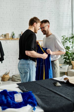 Two men, partners in both love and design, standing collaboratively in their workshop.