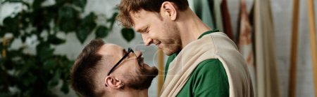 Téléchargez les photos : Gay couple shares a tender moment amidst their creative clothing design process. - en image libre de droit