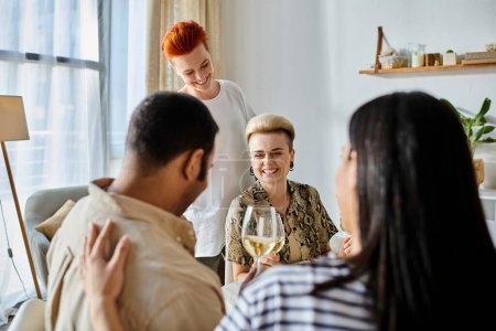 Diverse group of friends, including a loving lesbian couple, enjoy wine around a table.