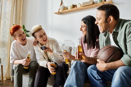 Diverse group holding beers on a couch.