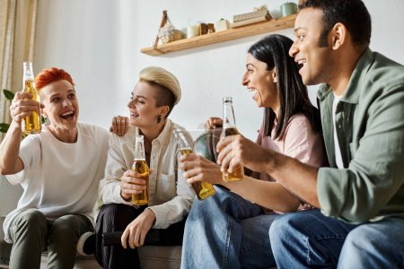 Photo for Diverse group enjoying beer on couch. - Royalty Free Image