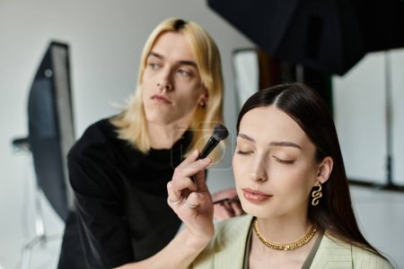 Professional makeup artist applies makeup on a womans face, enhancing her beauty.