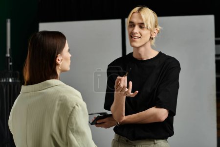 Woman engaged in conversation with man in black shirt.
