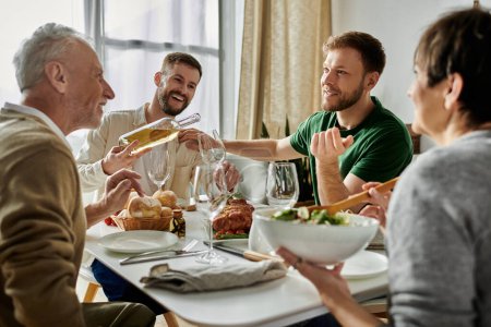 A gay couple enjoys a meal with their family at home.
