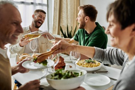 A gay couple enjoys a meal with their family, sharing laughter and good times.