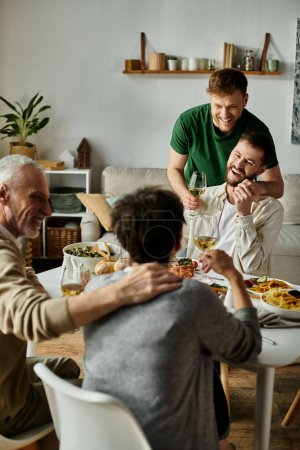 Photo for A gay couple enjoys dinner with parents at home. - Royalty Free Image