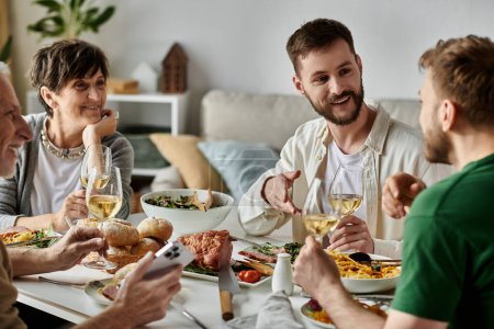 A gay couple shares a meal with parents at home.