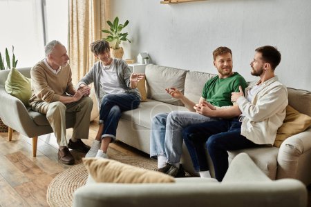 A gay couple sits on a couch while parents sit nearby, all engaging in conversation.