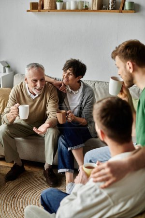 A gay couple meets with parents for tea in a cozy living room.