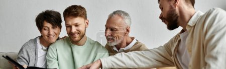 Photo for A gay couple introduces their partners to parents at home. - Royalty Free Image