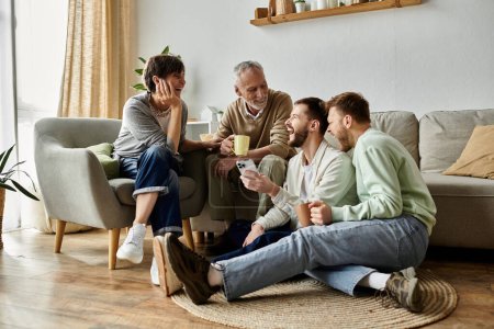 A gay couple sits on the floor with parents, laughing and enjoying a cozy moment at home.