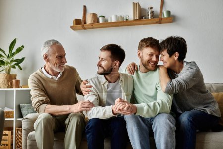 A gay couple sits with parents on a couch in their home.