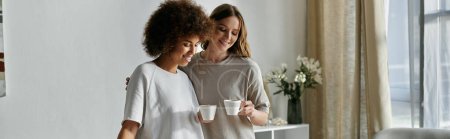 Photo for Two women share a moment at home, enjoying coffee together. - Royalty Free Image