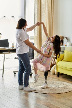 A mother and her daughter with a prosthetic leg dance together in their home, showcasing a loving and supportive bond.