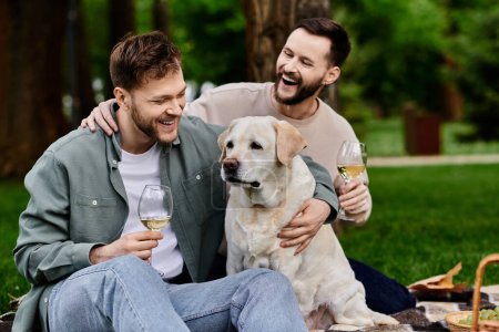 A bearded gay couple enjoys a picnic with their labrador dog in a lush green park.