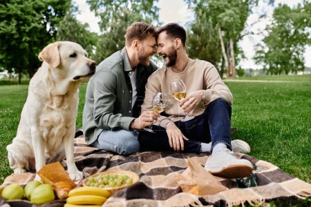 A bearded gay couple enjoys a picnic with their labrador in a green park, sharing a toast and a laugh.