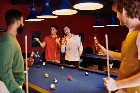 A group of friends gather around a pool table in a dimly lit room, laughing and enjoying a casual game.