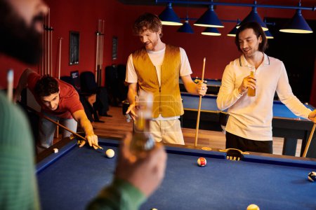 Friends enjoy a game of billiards in a dimly lit bar, laughing and enjoying each others company.