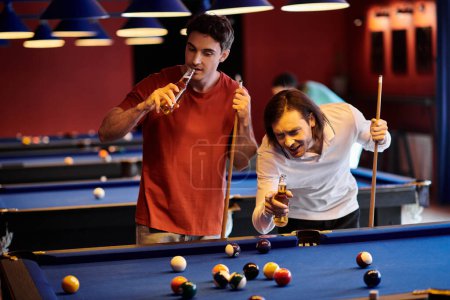 Friends play a friendly game of pool at a bar, enjoying drinks and some laughs.