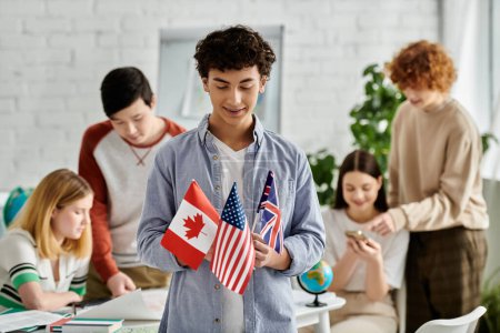Foto de Adolescente sostiene banderas de Canadá, EE.UU., Reino Unido en Conferencia Modelo de la ONU. - Imagen libre de derechos