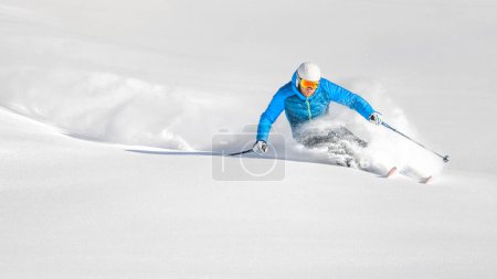 Skier in powder during a carving turn on a free-ride day