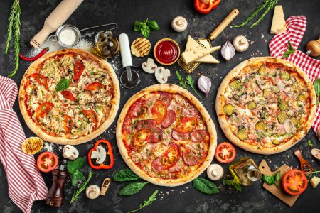 pizza set on a dark background, Fast food lunch, vertical image. top view. place for text,
