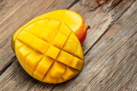 Photo for Mango. Fresh tropical fruit on a wooden background. place for text, top view. - Royalty Free Image