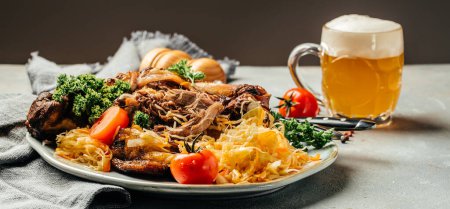 Photo for German cuisine, Roasted knuckle of pork with beer isolated on dark background, Bavarian grilled pork knuckle. Oktoberfest. banner, menu, recipe, place for text, - Royalty Free Image