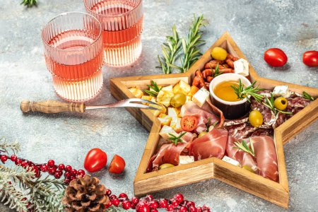 Assorted cheeses and deli meat appetizers. Festive Appetizer for christmas table. place for text, top view.