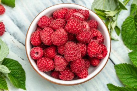 Photo for Organic raspberries, Fresh raspberries in bowl. Ripe juicy fresh raspberries. healthy food, vitamins, summer berry fruit. Long banner format. place for text, - Royalty Free Image