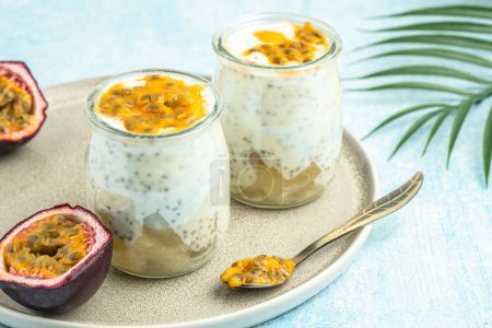 Photo for Healthy tropical fruit chia pudding with passionfruit in a glass, Delicious breakfast or snack, Clean eating, dieting, vegan food concept. top view, - Royalty Free Image