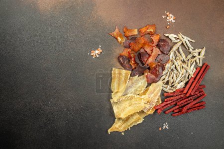 Photo for Variety of dried fish, snacks for beer on a dark background. place for text, top view. - Royalty Free Image