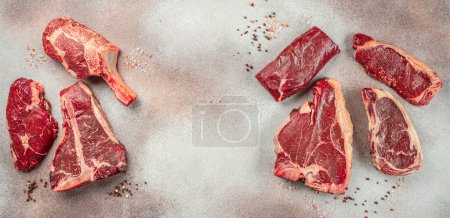 Photo for Set of various uncooked stakes t bone tomahawk sirloin ribeye beef on a light background. banner, menu, recipe place for text, top view. - Royalty Free Image