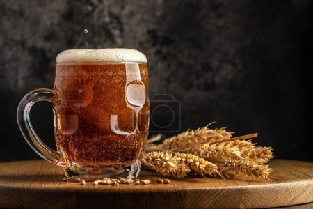 beer, wheat ears on a wooden board. banner, menu, recipe place for text.