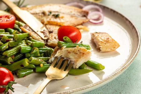 Grilled fish fillet with vegetables. Healthy food concept. place for text, top view.