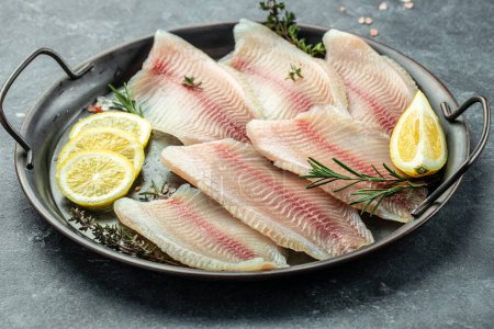 Photo for Raw tilapia fish fillet meat. ready to cook. superfood concept. Healthy, clean eating. place for text, top view. - Royalty Free Image