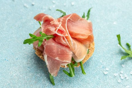 Photo for Delicious appetiser Italian prosciutto and Spanish Iberian ham snack. Food recipe background. Close up. - Royalty Free Image