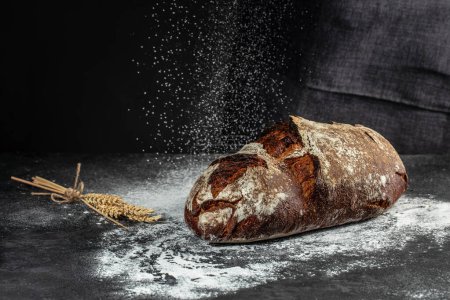 Photo for Artisanal bread on a dark background. banner, menu, recipe place for text, top view. - Royalty Free Image