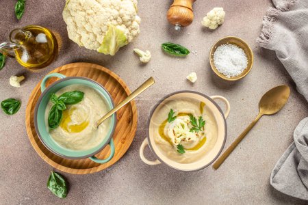 Cauliflower puree soup and ingredients. Detox and healthy superfoods bowl concept.