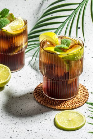 Photo for Cuba Libre or long island iced cocktail on a light background, cookbook recipe top view. - Royalty Free Image