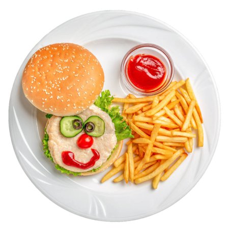 Foto de Menú infantil, papas fritas con chuleta en el plato. comida divertida cara sabrosa hamburguesa aislada sobre fondo blanco. - Imagen libre de derechos