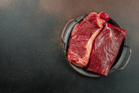 Set black angus prime beef steak variety on dark background. Steak types. top view