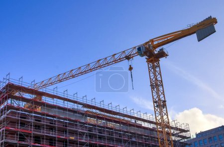 Foto de Kiel, Germany - 27.December 2022: Several cranes on constructions sites at high buildings - Imagen libre de derechos