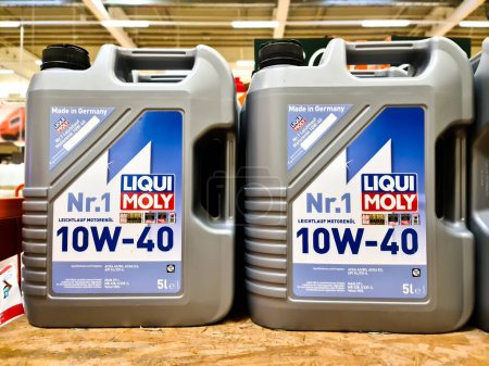 Photo for Kiel, Germany - 11 February 2023: Two canisters of Liqui Moly brand motor oil - Royalty Free Image
