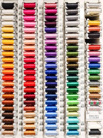 Photo for A display stand with Gtermann sewing thread in different colors for sale - Royalty Free Image