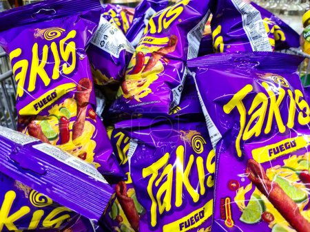 Photo for Kiel, Germany - 23.May 2024: Several purple bags of Takis brand hot chips in a supermarket - Royalty Free Image