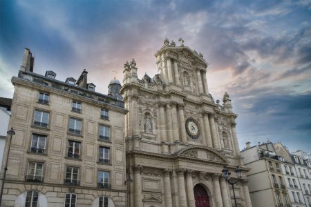 Photo for Paris, the Saint-Paul church in the Marais, rue Saint-Antoine, with ancient buildings - Royalty Free Image
