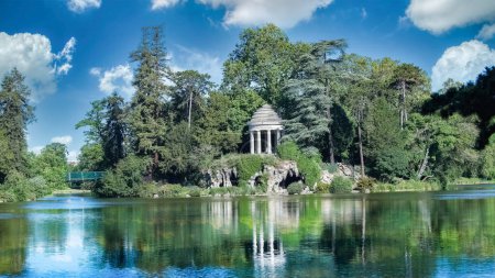 Photo for Vincennes, the temple of love and artificial grotto on the Daumesnil lake, in the public park - Royalty Free Image