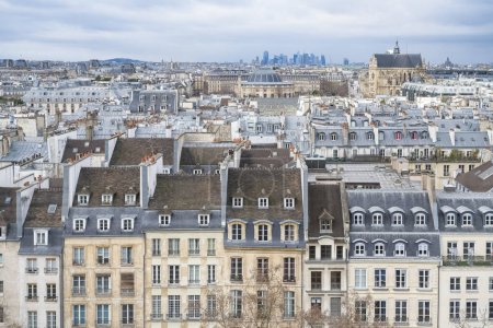 Photo for Paris, typical roofs in the Marais, aerial view with the Halles, the Saint-Eustache church and the Defense in background - Royalty Free Image