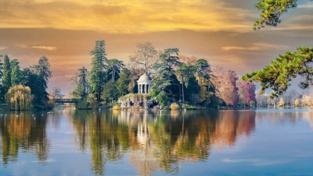 Photo for Vincennes, the temple of love and artificial grotto on the Daumesnil lake, in the public park, in autumn - Royalty Free Image